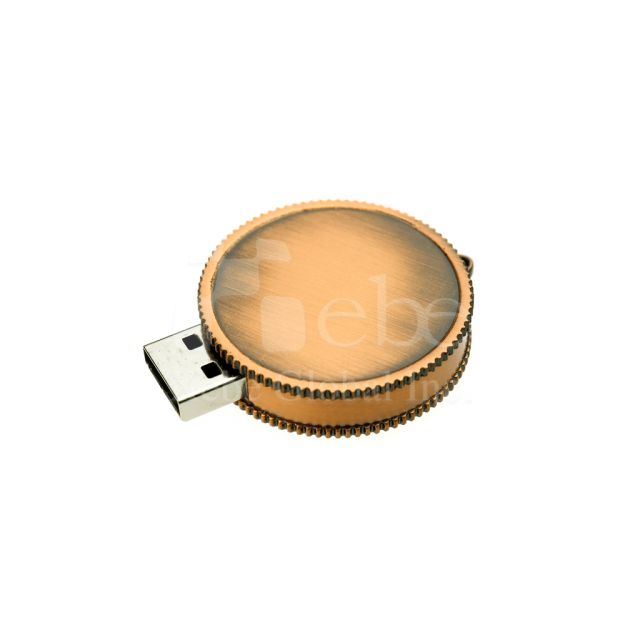 Old coin shaped metal USB drive