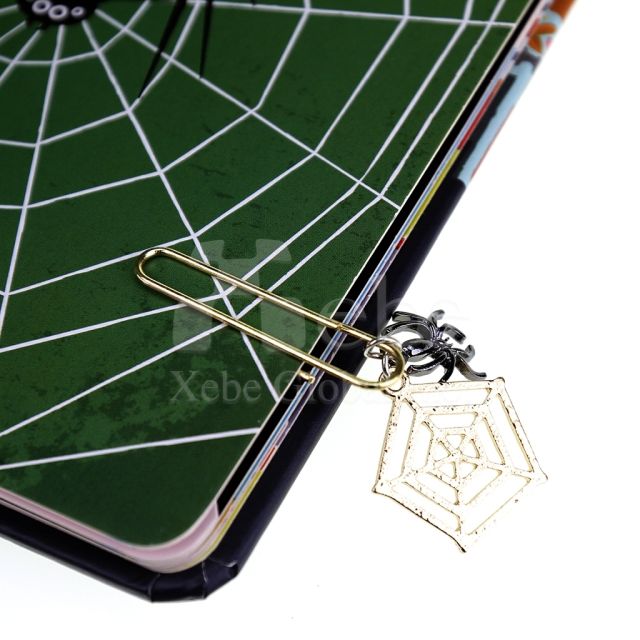 spider web charm shaped like a paperclip