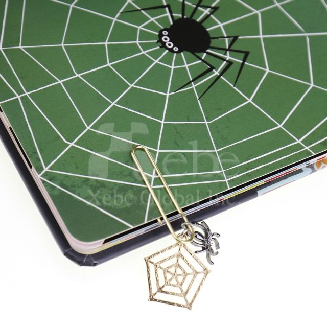 spider web charm shaped like a paperclip