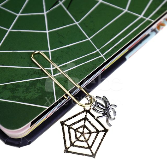 spider web charm shaped like a paperclip